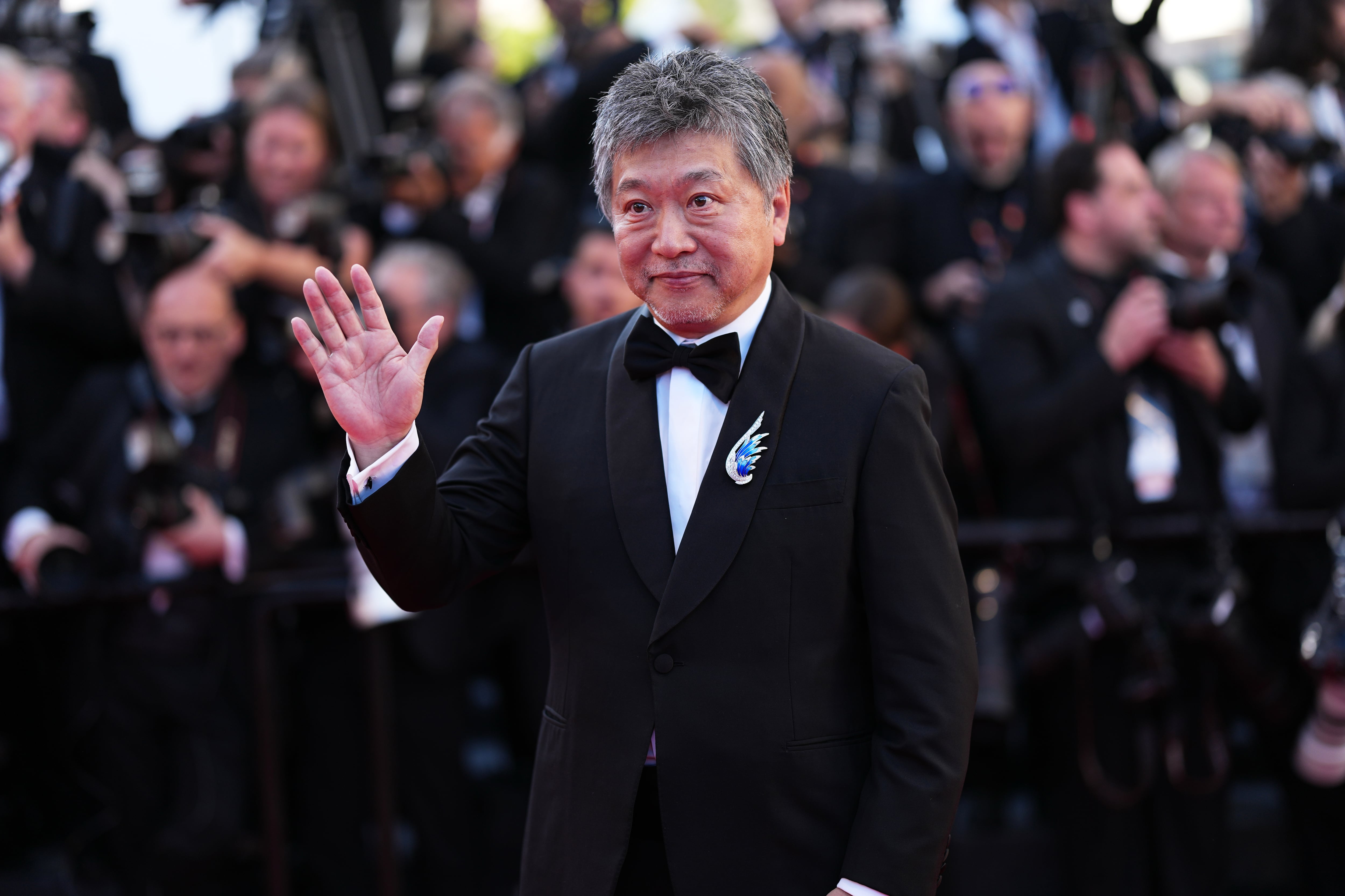 Hirokazu Koreeda poses for photographers at the opening ceremony and premiere of the film 'The Electric Kiss' during 79th international film festival, Cannes, southern France, Tuesday, May 12, 2026. (Photo by Scott A Garfitt/Invision/AP)