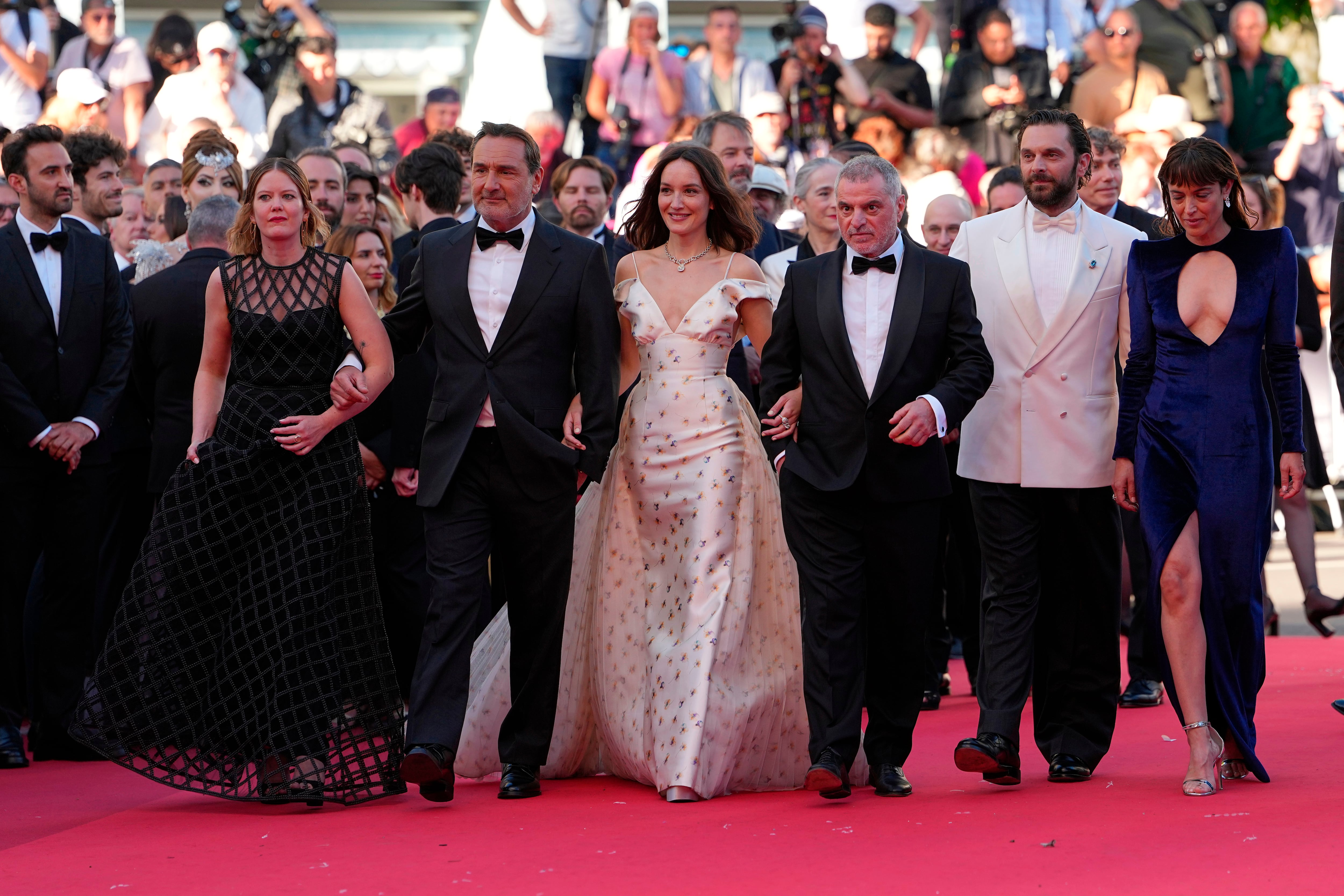 Madeleine Baudot, from left, Gilles Lellouche, Anaïs Demoustier, director Pierre Salvadori, Pio Marmaï and Vimala Pons pose for photographers at the opening ceremony and premiere of the film 'The Electric Kiss' during 79th international film festival, Cannes, southern France, Tuesday, May 12, 2026. (AP Photo/Andreea Alexandru)