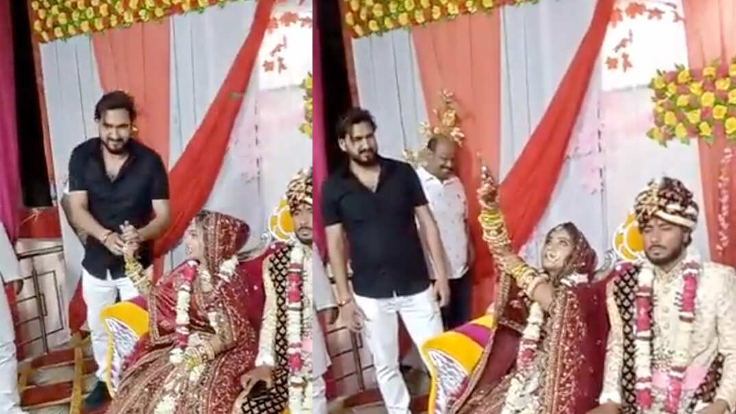 Novia india disparando al aire en su boda